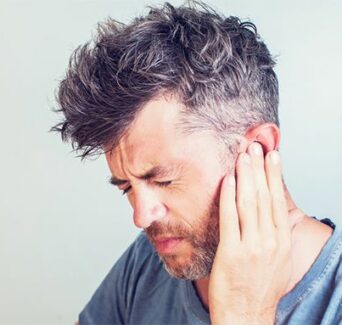 man suffers from ringing in the ears